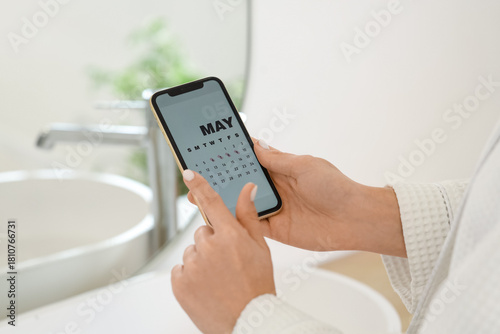 Young woman holding mobile ...