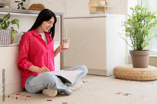 Young woman with glass of i...