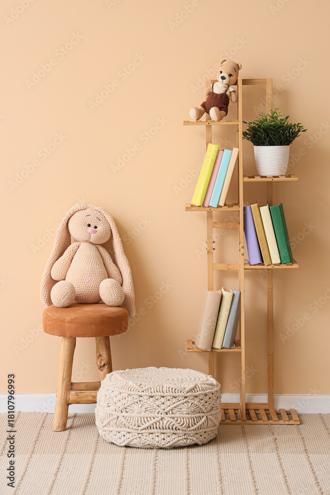 Naklejka premium Interior of children's room with bookshelf, toys and poufs