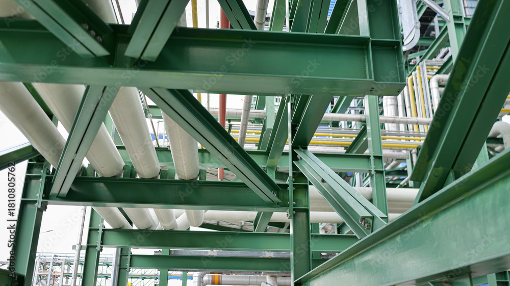 Fototapeta premium steel structure frame with pipelines, industrial support frame, factory pipe system, structural steel network, industrial piping layout