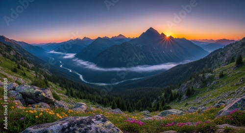 Majestic alpine sunrise illuminating serene mountain peaks and valleys blanketed in mist