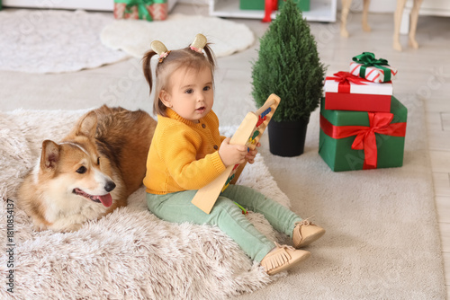 Cute little girl with Corgi...