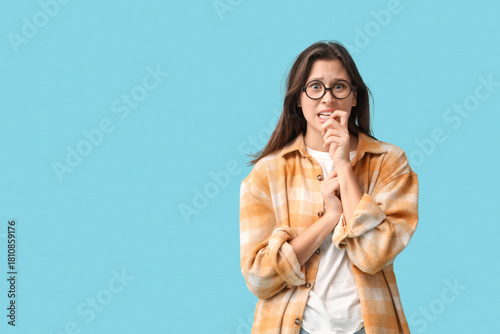 Scared young woman in eyegl...