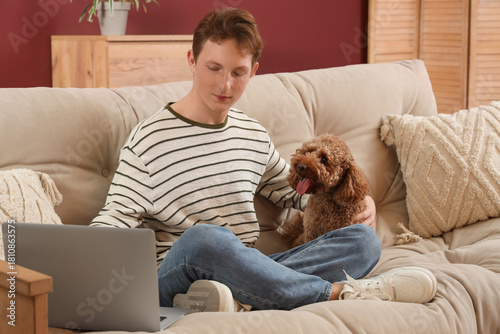 Young man using modern lapt...