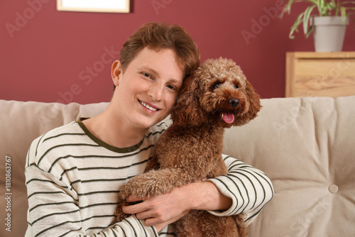 Young man hugging cute Toy ...