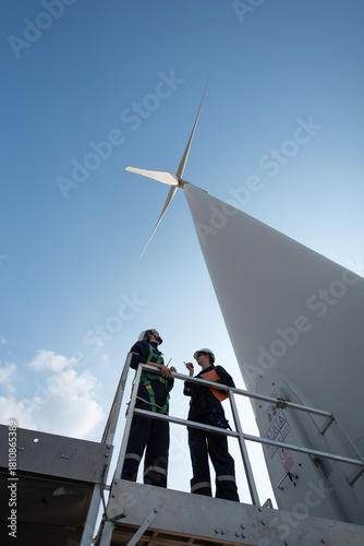Wind Turbine Maintenance and Repair Technician, Engineer Checking Turbines working maintenance clean power generator system