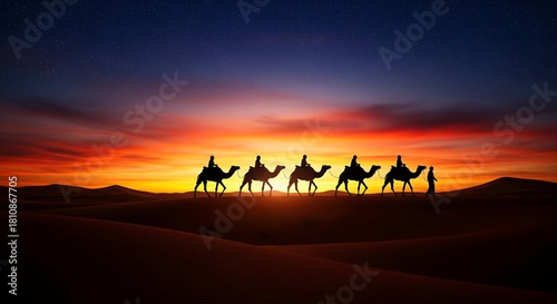 Fototapeta Naklejka Na Ścianę i Meble -  Silhouetted camel caravan at sunset with a vivid sky and sand dunes.