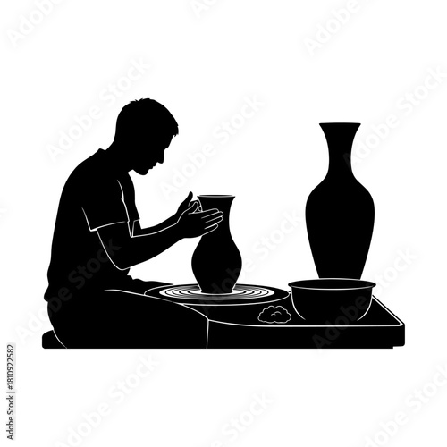 Silhouette of a potter crafting a vase on a pottery wheel.