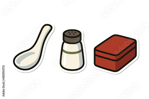 Essential kitchen items set including spoon, salt shaker, seasoning, and food container