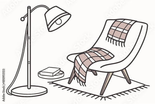 Armchair with blanket floor lamp and book Keywords: armchair, chair, blanket, throw, floor lamp