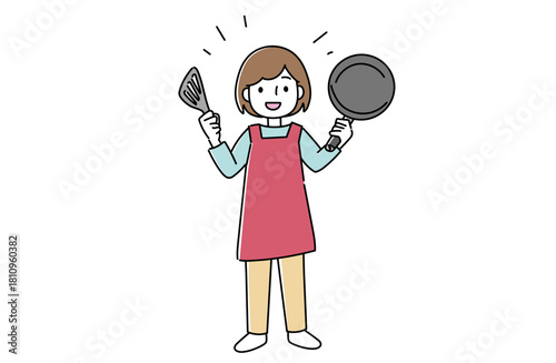 フライパンとフライ返しを持つ女性