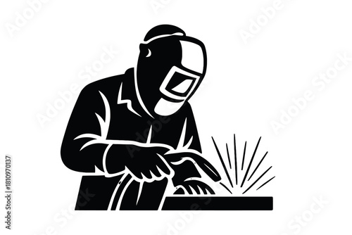 Welder working with protective mask and torch creating sparks during metal fabrication process