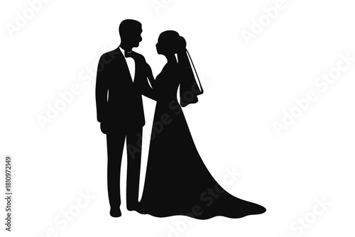Romantic black silhouette of a newlywed couple, the bride in a flowing gown and the groom in a tuxedo