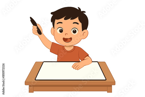 Happy schoolboy sitting at wooden desk holding pen ready to draw or write
