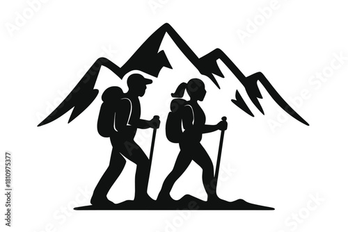 Silhouette of two hikers with backpacks and trekking poles against mountain range
