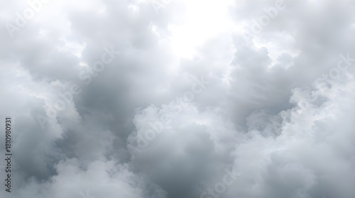 Light shining through  pearly gray stormy clouds with dramatic texture, background