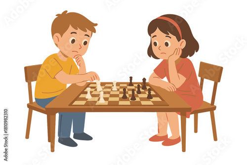 Focused young boy and girl sitting at a table playing a serious game of chess