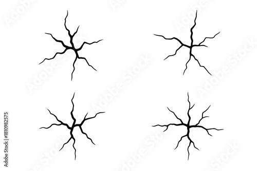 Four different black impact cracks and fissures isolated on a white surface