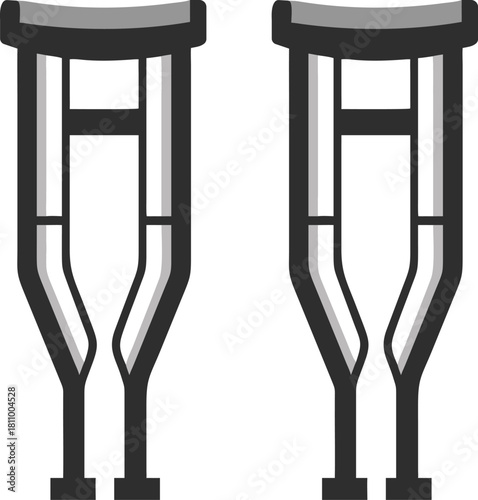 Pair of medical crutches standing upright isolated on a white background for mobility assistance