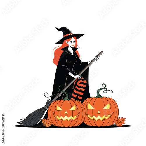 Beautiful red-haired witch in a black cloak holding a broomstick and standing behind two large carved Halloween pumpkins.