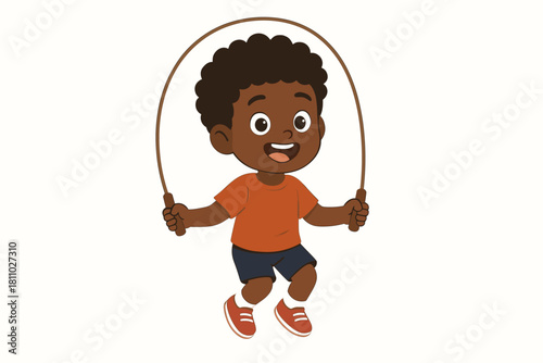 Energetic young boy with dark skin skipping rope happily during physical activity