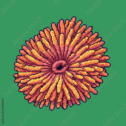 A detailed pixel art illustration of a vibrant orange and pink spiky organism with a dark center on a solid green background.