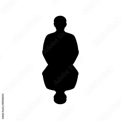 A lone man standing mirrored in a pool of darkness and light