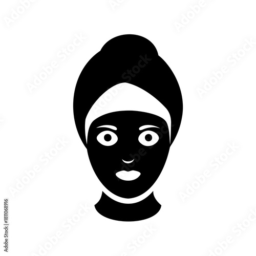 Silhouette of a woman with a towel on her head and facial mask