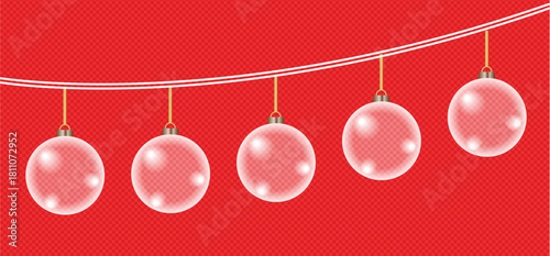 A string of clear translucent christmas ornaments against a bright red background