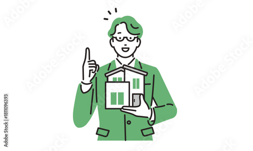 住宅の模型を持つビジネスパーソンの男性