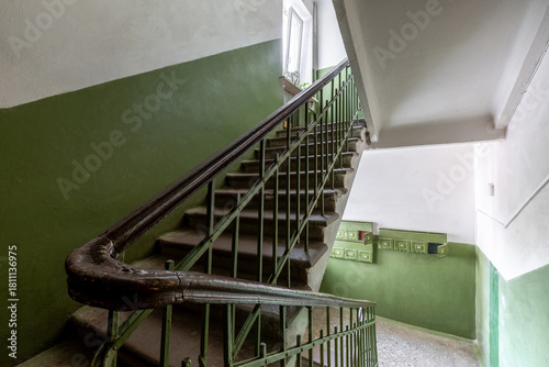 Old Staircase in Residential Building with Green Walls