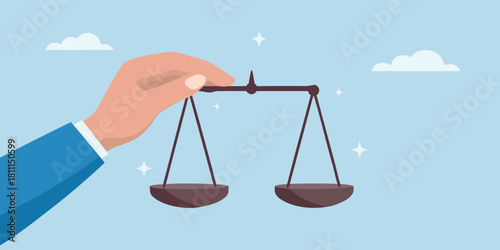 Hand holding scales of justice in the sky concept of fairness