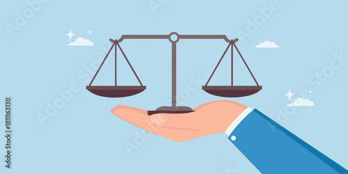 Hand holding scales of justice symbolizing fairness and legal balance