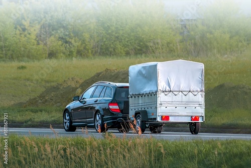 Konstfotografi Travel and logistics with SUV and trailer