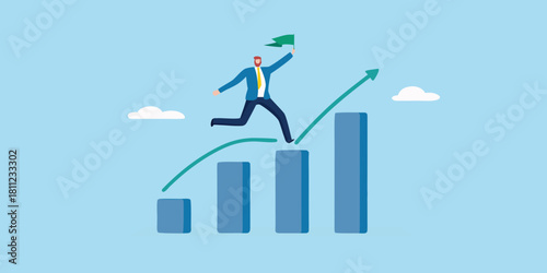 Businessman running up bar graph with flag towards success and growth