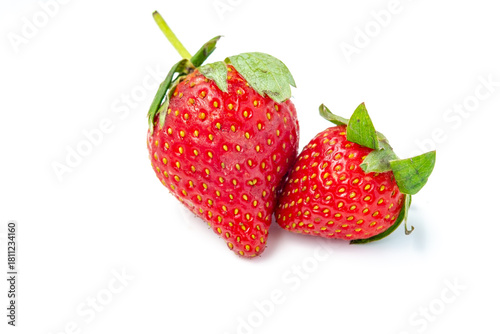 Wallpaper Mural Trio of three fresh, vibrant red strawberries clustered together, complete with green stems and leaves. Isolated on a clean white background for easy digital manipulation and cutouts. Torontodigital.ca