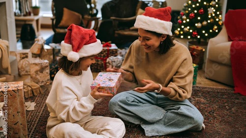Mother and daughter exchanging gifts on Christmas morning, expressing family love and warmth. Perfect for emotional campaigns and holiday visuals.