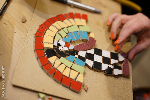 Making mosaic during artistic workshop. 