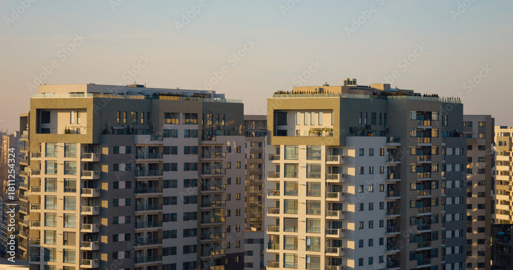 Obraz premium Residential blocks featuring balconies and terraces in urban environment