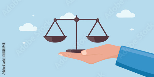 Hand holding scales of justice in a light blue sky setting