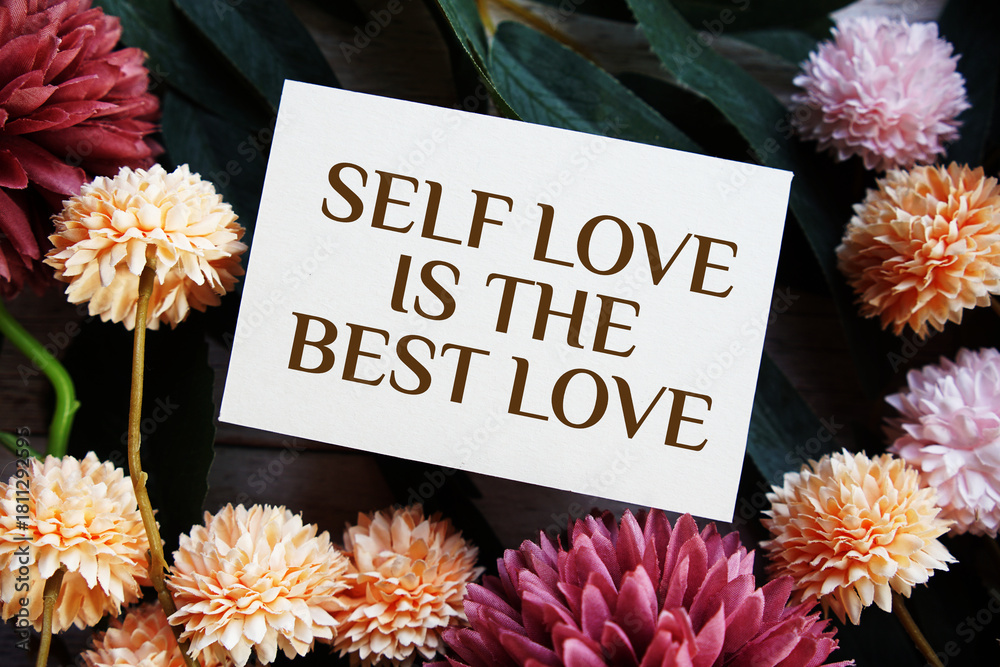 Naklejka premium Self love is the best love Motivational and Inspirational quotes with flowers bouquet decoration on wooen background