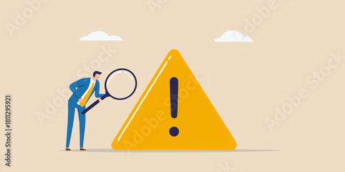 Risk assessment with magnifying glass and danger sign problem analysis concept