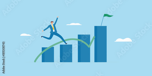 Businessman jumping over chart to reach goal business success concept