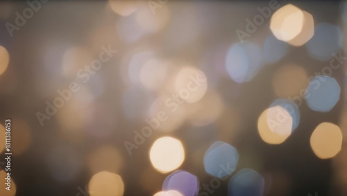 Abstract bokeh background of soft, out-of-focus lights in warm hues with a hazy atmosphere