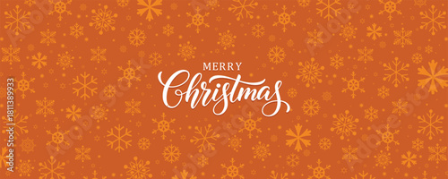 Warm Christmas vector banner featuring white "Merry Christmas" script calligraphy centered over an orange/brown background with a seamless pattern of slightly darker snowflakes. Festive design for gre