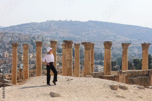 Woman Posing Among Ancient Roman Columns in Jerash, Jordan