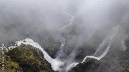 Vøringsfossen Waterfall Plunging Into Deep Foggy Canyon Norway