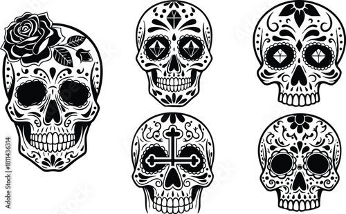 Black and white sugar skull designs with floral and ornamental patterns for Day of the Dead celebration and tattoo art