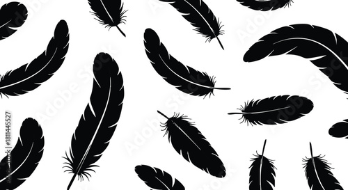 Black feathers scattered on white background seamless pattern design for textile and wallpaper use