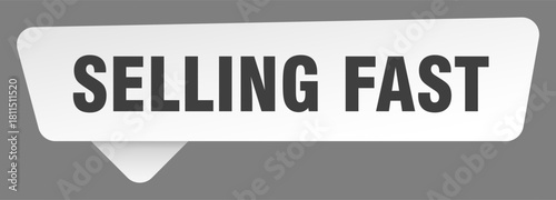 selling fast sign. selling fast white sticker isolated on gray background